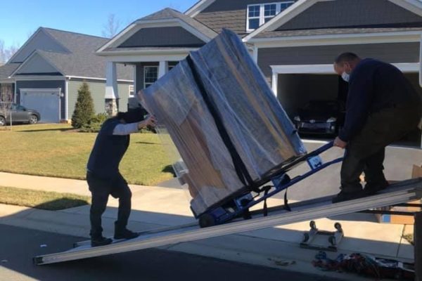 Unloading customer items off of moving truck